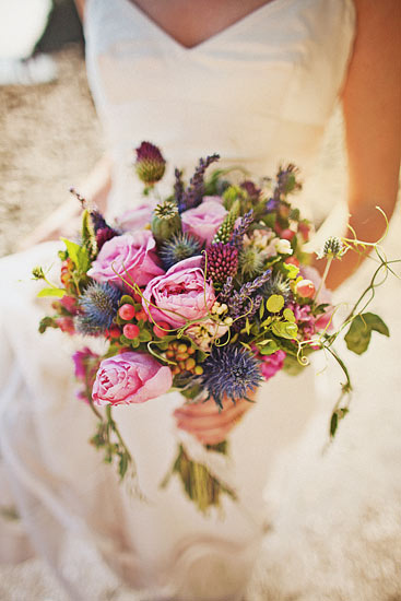 Colorful and organic bridal bouquet with shades of green and pink - photo by Ryan Flynn Photography